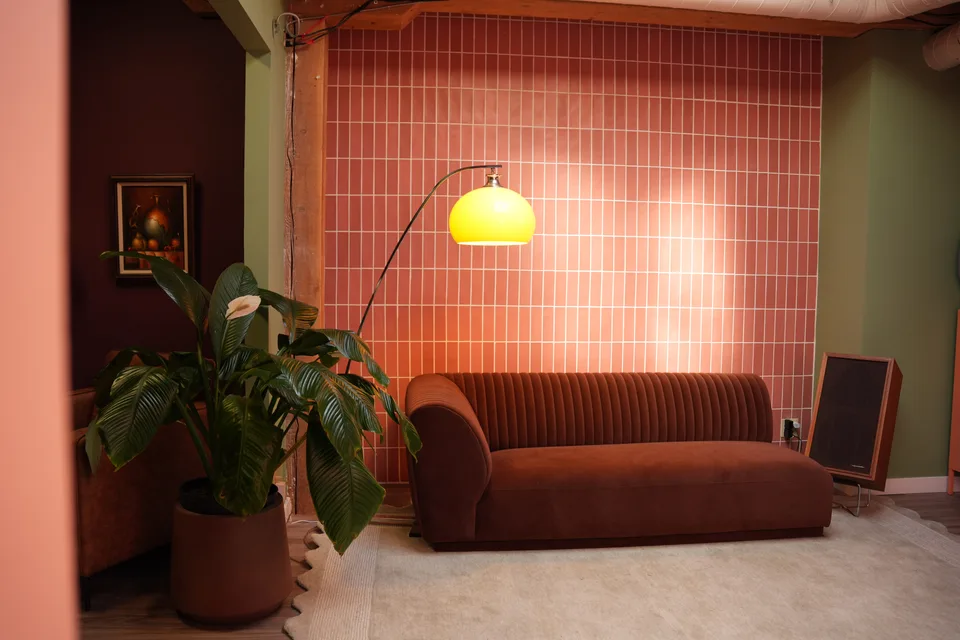 The tiled wall and seating in The Tulum Lounge, used as a photo backdrop
